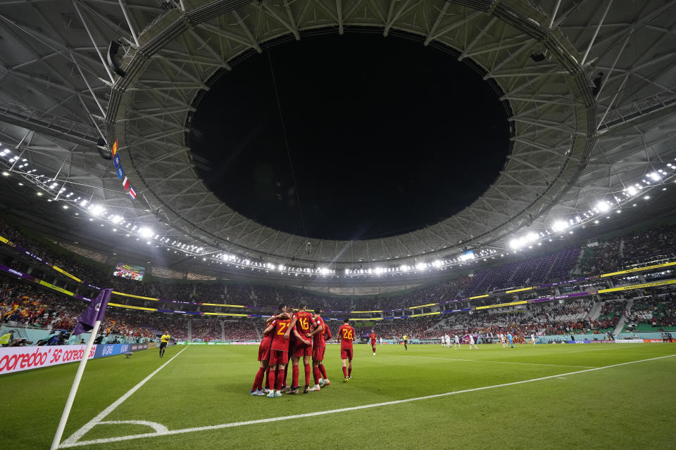 Spain's Dani Olmo celebrates with teammates after scoring his side's first goal during the World Cup group E soccer match between Spain and Costa Rica, at the Al Thumama Stadium in Doha, Qatar, Wednesday, Nov. 23, 2022. (AP Photo/Julio Cortez)