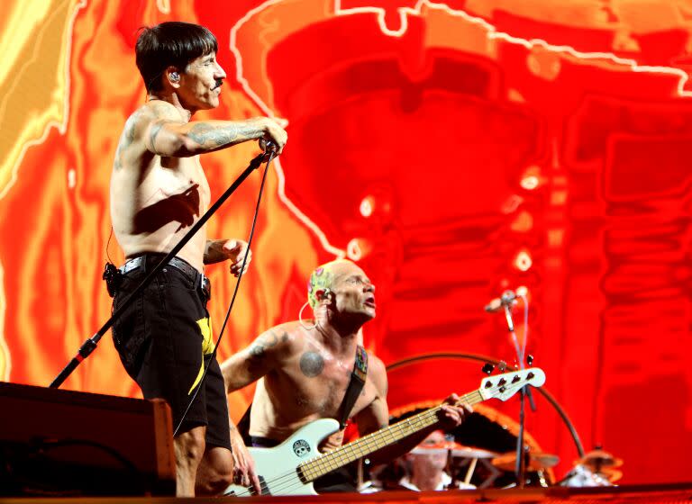 Red Hot Chili Peppers continue their Global Stadium Tour at SoFi Stadium in Inglewood on Sunday, July 31, 2022. Above, lead singer Anthony Kiedis, left and bassist Flea.