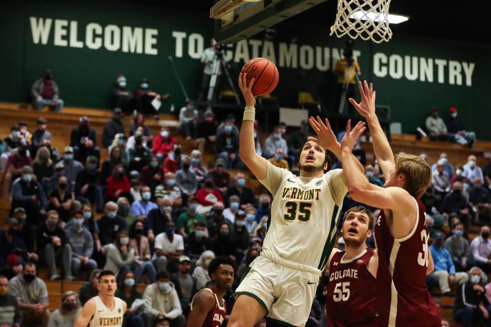 Vermont's Ryan Davis goes up for two against Colgate in a men's basketball game at Patrick Gym on Wednesday.