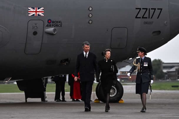 PHOTO: Princess Anne and Vice Admiral Timothy Laurence are greeted by Station Commander Group Captain McPhaden, having disembarked from the C-17 carrying the coffin of Queen Elizabeth II at the Royal Air Force Northolt airbase on Sept. 13, 2022. (Ben Stansall/PA Wire via ZUMA Press)