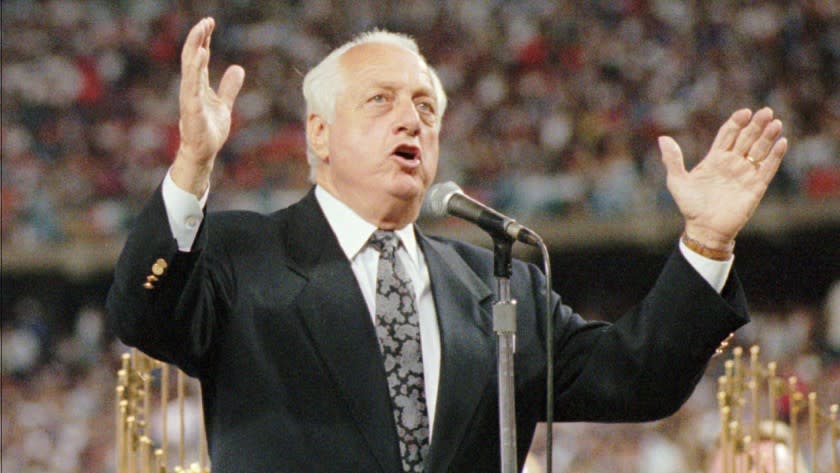 Tom Lasorda speaks during a ceremony held in his honor at Dodger Stadium on Sept. 7, 1996. Lasorda suffered a heart attack in June 1996 and retired as the Dodgers manager on July 29, 1996.