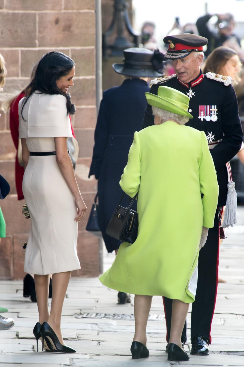 CHESTER, ENGLAND - JUNE 14:  Meghan, Duchess of Sussex and Queen Elizabeth II share a smile as they speak with the Lord Lieutenant as they leave Chester Town Hall on June 14, 2018 in Chester, England. Meghan Markle married Prince Harry last month to become Meghan, Duchess of Sussex.  This is her first engagement with the Queen. During the visit the pair opened a road bridge in Widnes, visited The Storyhouse in Chester followed by the Town Hall.  (Photo by Anthony Devlin/Getty Images)