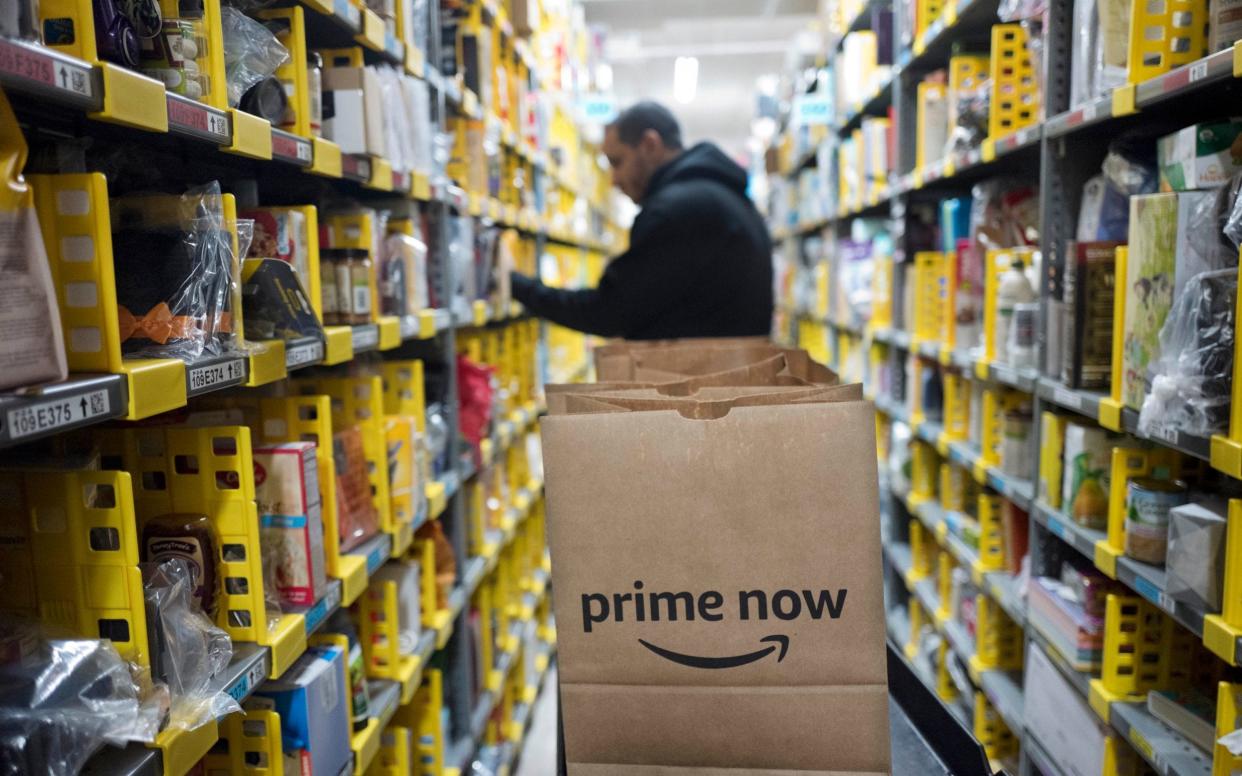 Amazon announced a second wage increase for its warehouse workers in the US - AP