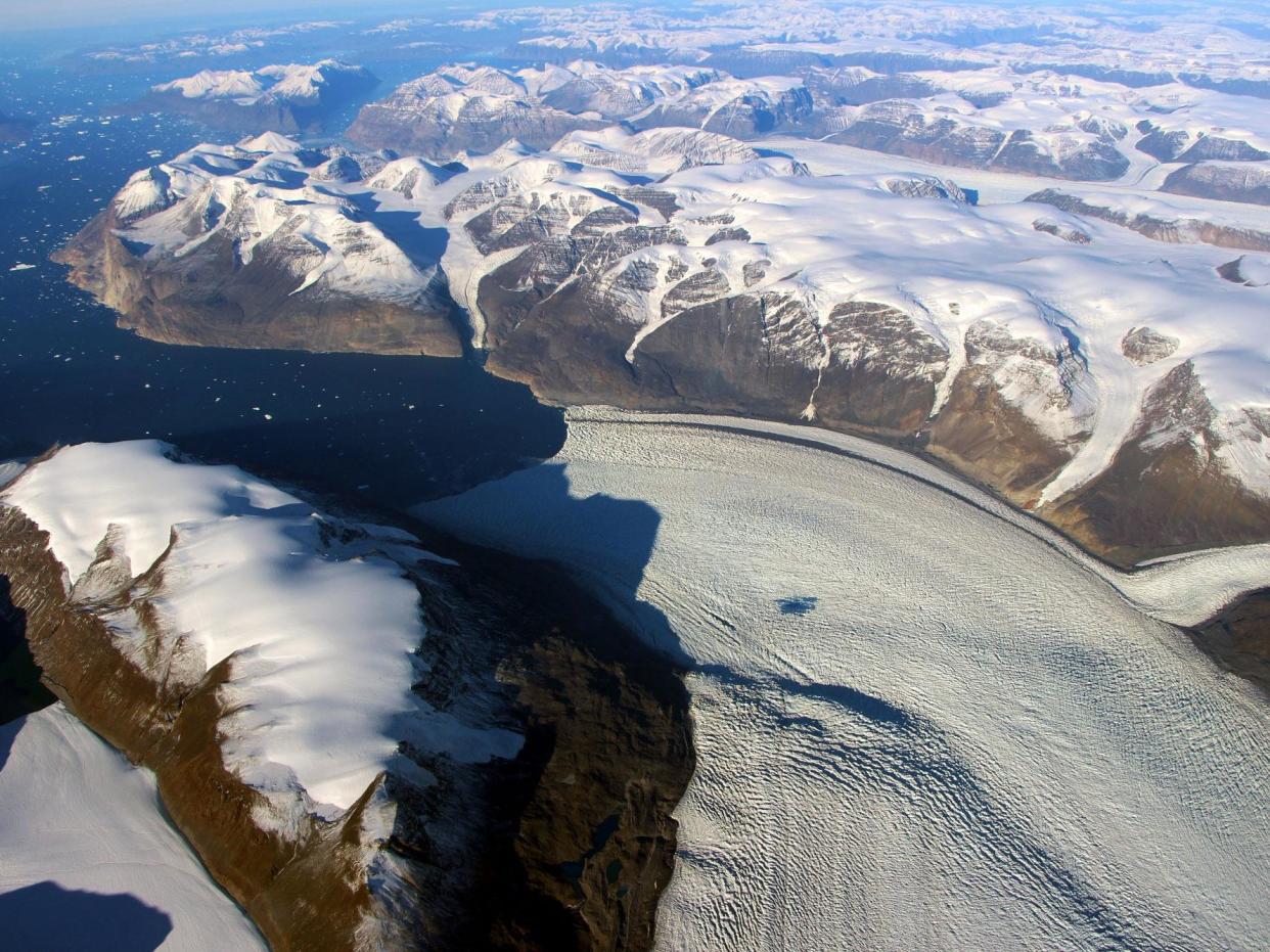 A meltwater lake can be seen on the Rink Glacier in western Greenland: Nasa/OIB