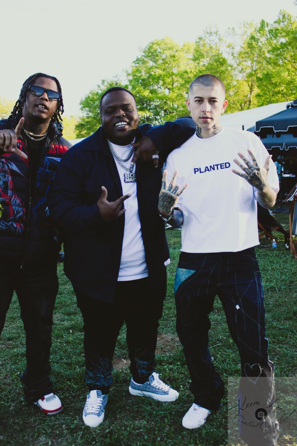Rapper Officially 2x, left, Morray and barber Vic Blends, backstage at the Dreamville Festival in Raleigh in April.