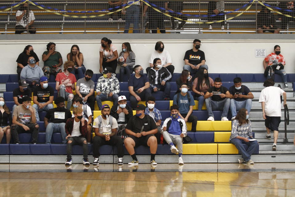 FILE - In this Aug. 11, 2021, file photo, students at Highland High School assemble for a rally on the first day of the fall semester in Albuquerque, N.M. New Mexico schools have begun spending the $1 billion in pandemic relief funding promised to them this year. For the first time, nearly all children in rural schools have access to a tablet or a laptop outside of school. (AP Photo/Cedar Attanasio, File)