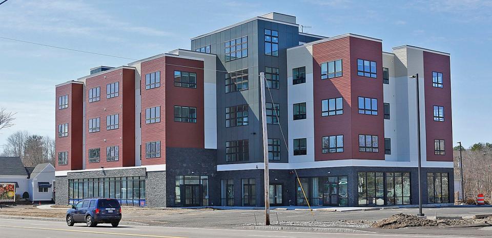 A new four-story apartment building on Route 18 in Weymouth is within walking distance to an MBTA Station.