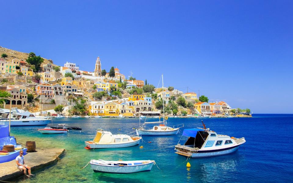 symi harbour, greece - Getty