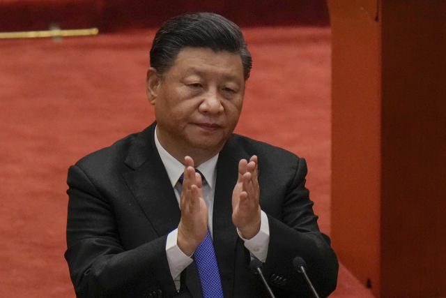 FILE - In this Oct. 9, 2021, file photo, Chinese President Xi Jinping applauds during an event commemorating the 110th anniversary of Xinhai Revolution at the Great Hall of the People in Beijing. After sending a record number of military aircraft to harass Taiwan over China’s National Day holiday weekend, Beijing has toned down the sabre rattling but tensions remain high, with the rhetoric and reasoning behind the exercises unchanged. (AP Photo/Andy Wong, File)