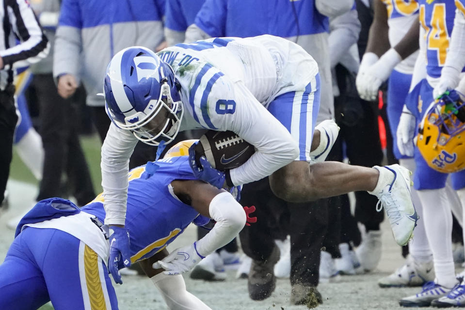 Duke wide receiver Jordan Moore (8) is toppled by Pittsburgh defensive back Jehvonn Lewis (41) after making a catch during the second half of an NCAA college football game, Saturday, Nov. 19, 2022, in Pittsburgh. Pittsburgh won 28-26. (AP Photo/Keith Srakocic)