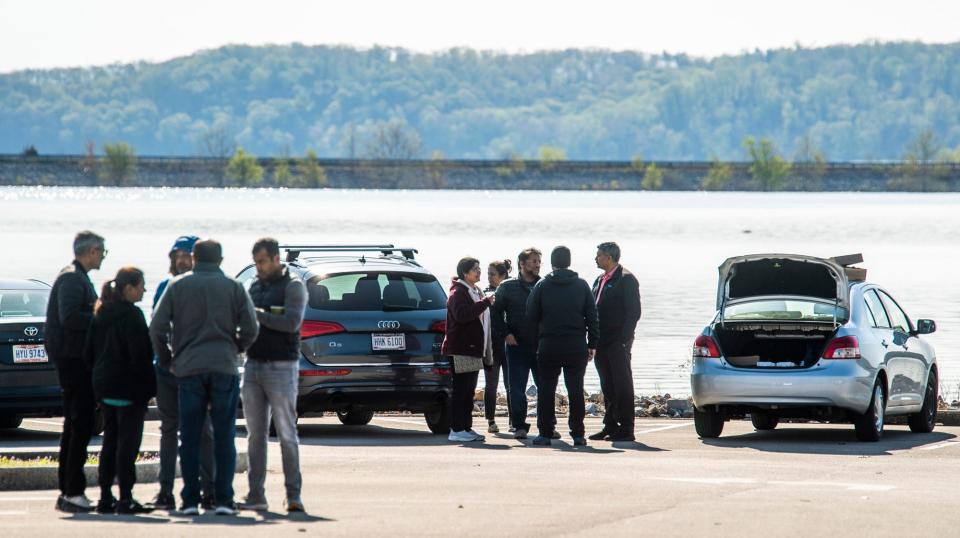 Friends, family and community members waited along the shore at Paynetown State Recreational Area as Indiana Conservation Officers continue the search for 19-year-old Siddhant Shah and 20-year-old Aryan Vaidya,