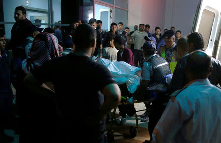 Residents and relatives of flood victims gather outside a hospital near the Dead Sea in Jordan October 25, 2018. REUTERS/Muhammad Hamed