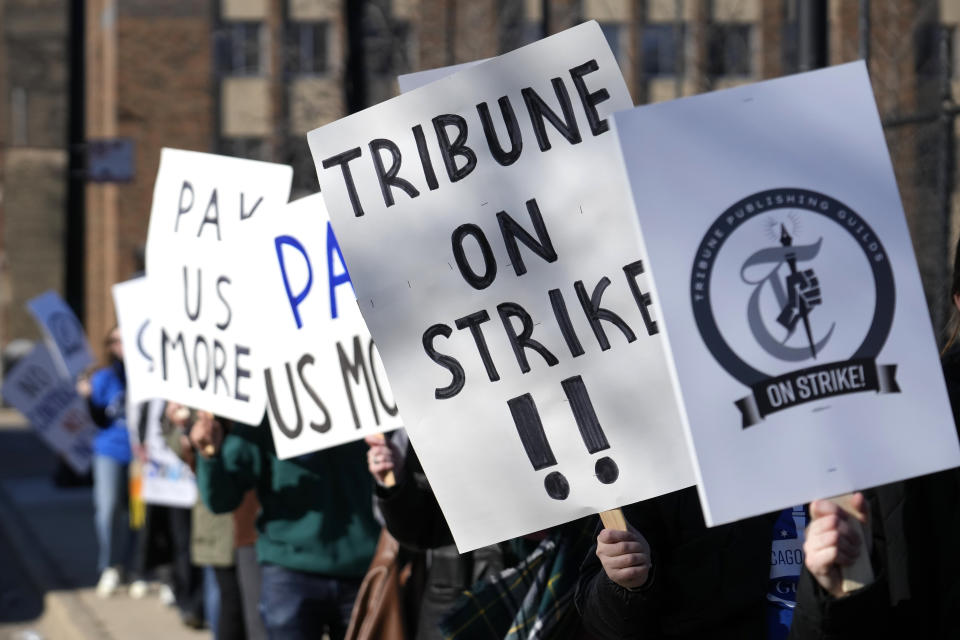 FILE - Chicago Tribune newsroom employees picket outside the newspapers Freedom Center newsroom and printing plant Thursday, Feb. 1, 2024, in Chicago. The Chicago Tribune is being sued, Thursday, May 16, by some of its staffers, who say they and other women and Black journalists are being paid less than their white male counterparts. (AP Photo/Charles Rex Arbogast, File)