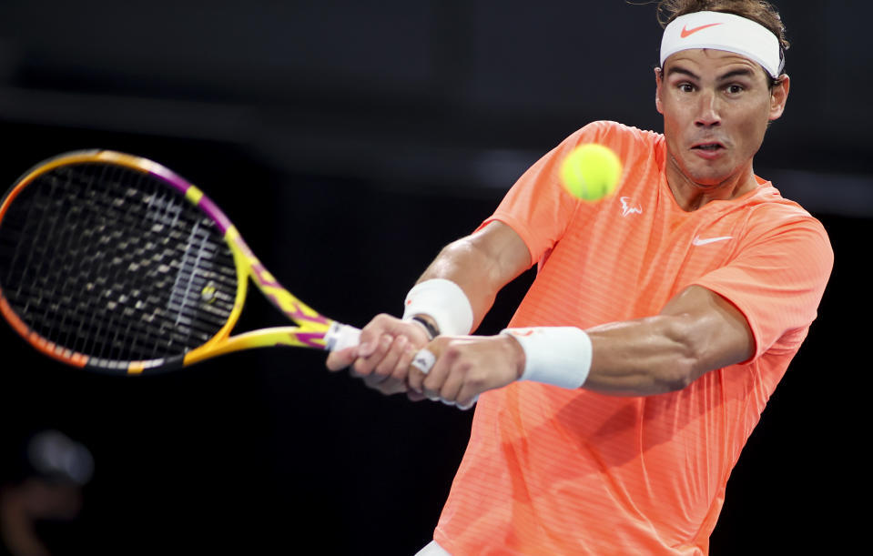 Spain's Rafael Nadal makes a backhand return to Austria's Dominic Thiem during an exhibition tennis event in Adelaide, Australia, Friday, Jan 29. 2021. (Kelly Barnes/AAP Image via AP)