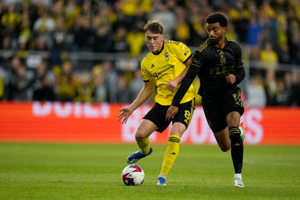 Dec 9, 2023; Columbus, OH, USA; Columbus Crew midfielder Aidan Morris (8) controls the ball Los Angeles FC midfielder Timothy Tillman (11) at Lower.com Field. Mandatory Credit: Adam Cairns-USA TODAY Sports