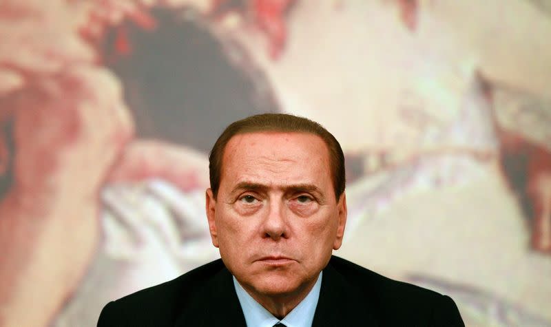 FILE PHOTO: Italy's Prime Minister Berlusconi looks on during a news conference at Chigi Palace in Rome