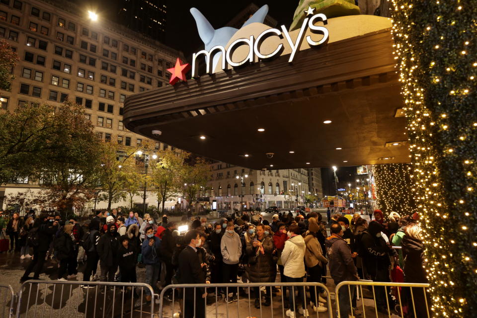 People wait in line at Macy&#39;s before Black Friday sales in the Manhattan borough of New York City, New York, U.S., November 26, 2021. REUTERS/Jeenah Moon - REFILE - CORRECTING DATE