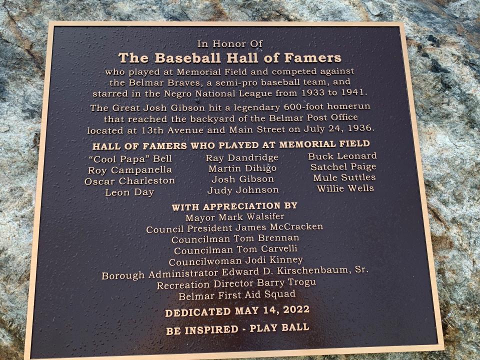 Close-up of the plaque affixed to a rock behind home plate at Belmar Memorial Field.