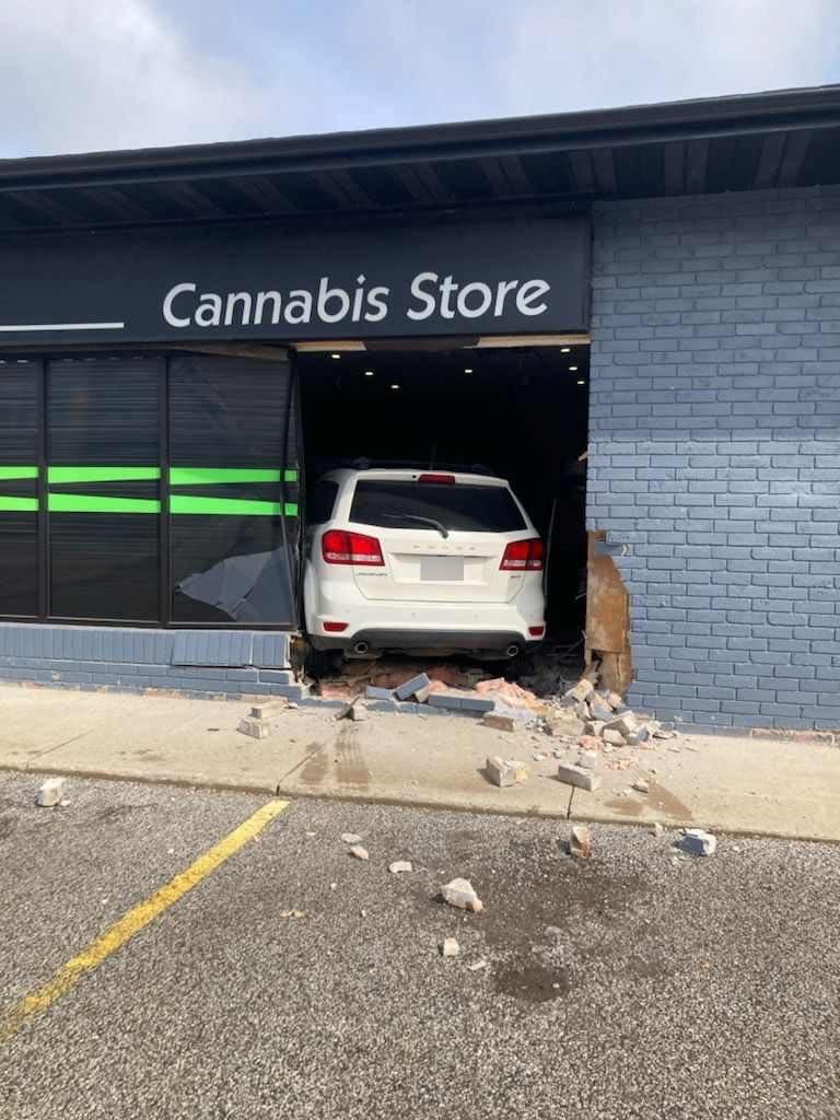 A car crashed into the front of a cannabis store in Harrow Thursday morning. No injuries were reported (Tony Smyth/X - image credit)