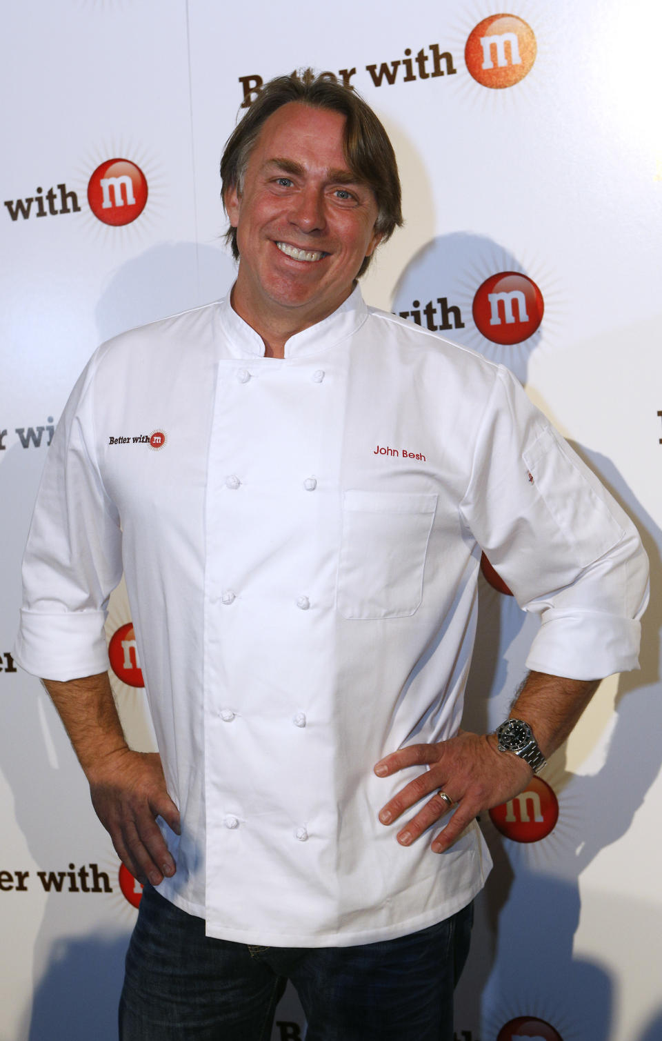 FILE - This Jan. 31, 2013 file photo originally released by Mars Chocolate North America shows New Orleans chef John Besh at the "Better With M" Kick-Off Event in New Orleans. Besh invited cameras into his bayou-side home in suburban New Orleans for the filming of a new cooking show, "Chef John Besh's Family Table." In the new 26-part series, Besh creates family-friendly meals and gives tips on how to get the most use out of ingredients for families looking for a good value. He hopes the show will inspire families to get back in the kitchen and gathered around the supper table. The show will air in parts of the Gulf Coast region on WYES beginning April 6, and it will be distributed nationwide through American Public Television. (AP Photo/Mars Chocolate North America, Jonathan Bachman)