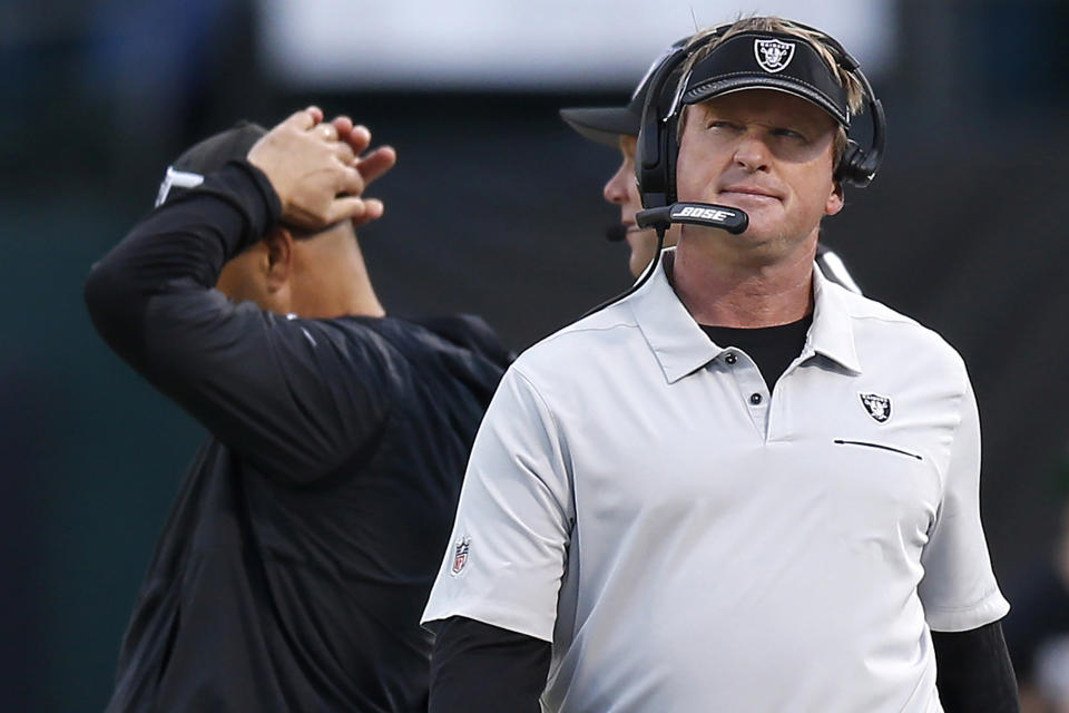 FILE - In this Dec. 8, 2019, file photo, Oakland Raiders head coach Jon Gruden walks on the sideline during the second half of an NFL football game against the Tennessee Titans in Oakland, Calif. Dealing with an offseason move to Las Vegas, an overhaul of his defense and contending in a division with Patrick Mahomes and the defending Super Bowl champion Kansas City Chiefs is a tough enough task for Gruden. It all pales in comparison to trying to keep his players safe from COVID-19 in a city where the coronavirus is spreading. (AP Photo/D. Ross Cameron, File)