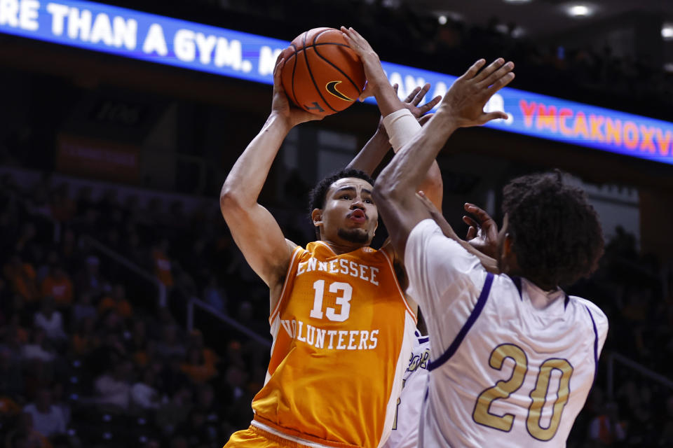 Tennessee forward Olivier Nkamhoua (13) goes to shoot as he is defended by Alcorn State forward Darryl Jordan (20) during the second half of an NCAA college basketball game Sunday, Dec. 4, 2022, in Knoxville, Tenn. (AP Photo/Wade Payne)