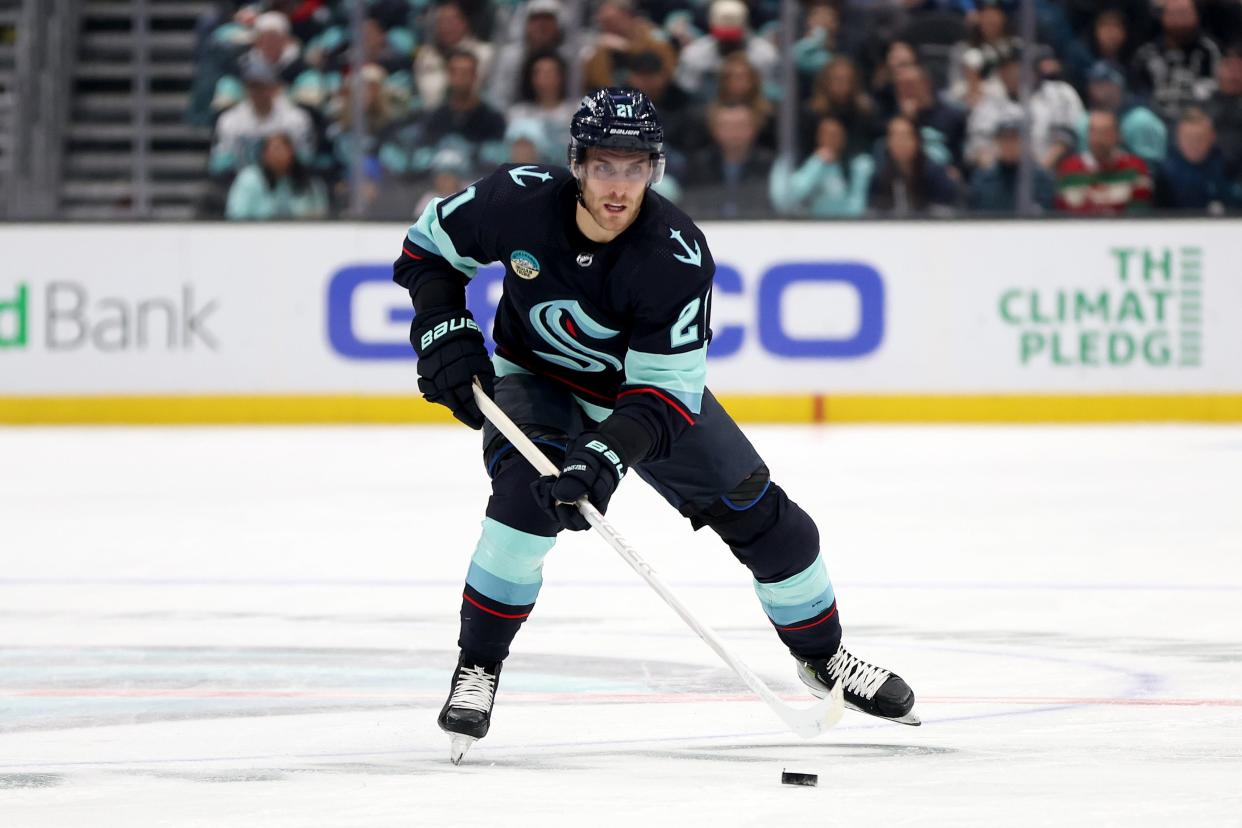 SEATTLE, WASHINGTON - DECEMBER 16: Alex Wennberg #21 of the Seattle Kraken skates against the Los Angeles Kings during the second period at Climate Pledge Arena on December 16, 2023 in Seattle, Washington.