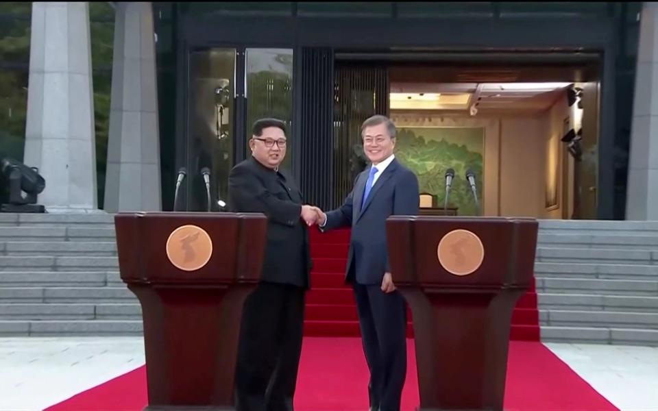 South Korean President Moon Jae-in and North Korean leader Kim Jong Un shake hands after delivering a joint statement during the inter-Korean summit at the truce village of Panmunjom - REUTERS