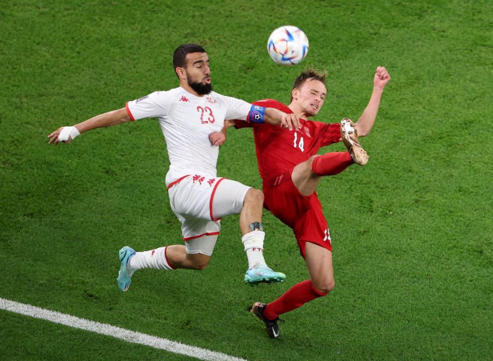 Tunisia's Naim Sliti in action with Denmark's Mikkel Damsgaard (REUTERS)