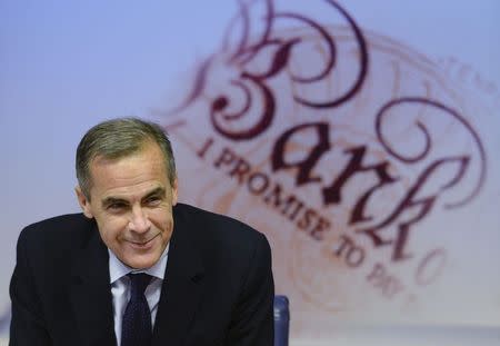 Bank of England Governor Mark Carney smiles during the bank's quarterly inflation report news conference at the Bank of England in London November 12, 2014. REUTERS/Stefan Rousseau/pool