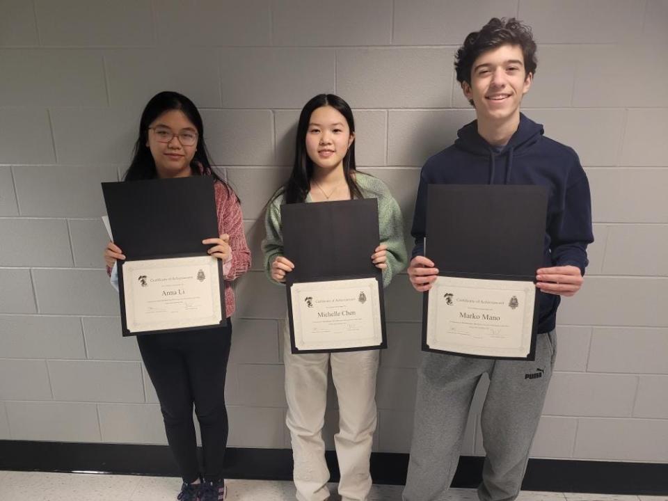 Grand prize winner Anna Li, left, with fellow North Quincy High School students Marko Mano and Michelle Chen, both of whom won third-place awards at the regional science fair held March 2 at Bridgewater State University.