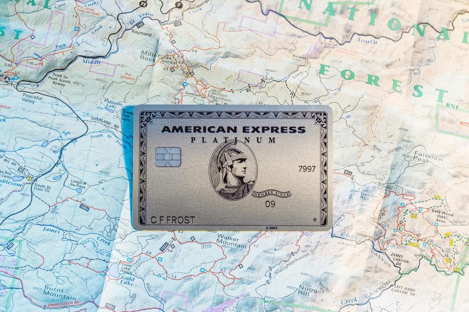 American Express platinum card on an open map