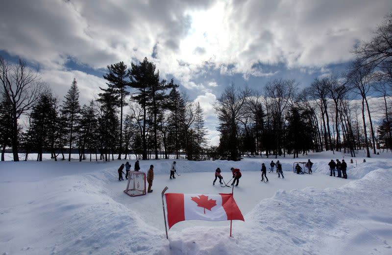 FILE PHOTO: Youths play pond hockey on Pigeon Lake near the town of Bobcaygeon