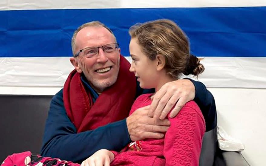 Emily is reunited with her father Thomas Hand after being held as a hostage by Hamas