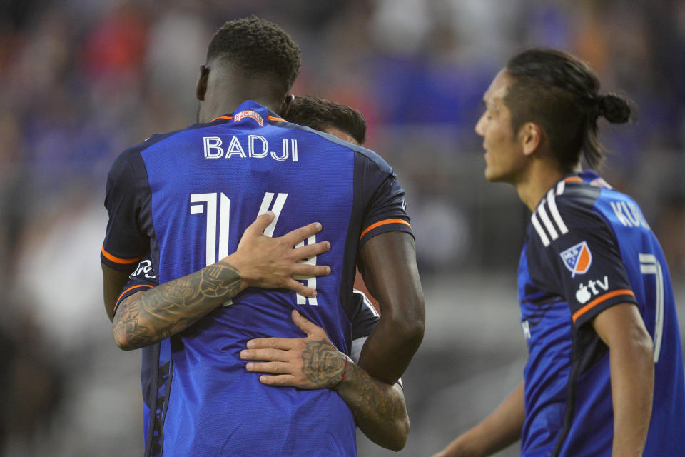 FC Cincinnati's Dominique Badji (14) celebrates with Luciano Acosta after scoring a gaol against Toronto FC during the second half of an MLS soccer match against Wednesday, June 21, 2023, in Cincinnati. (AP Photo/Jeff Dean)