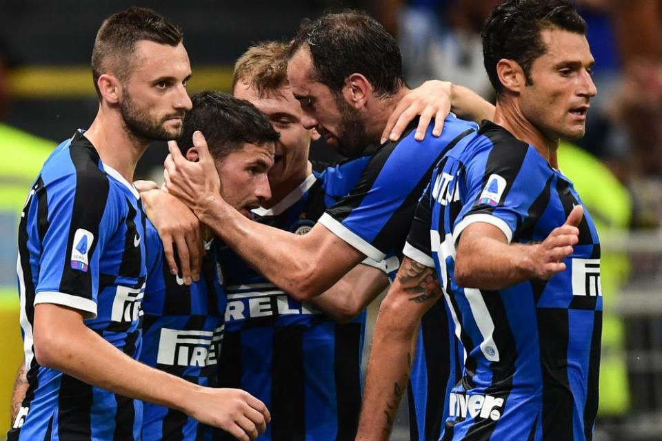 Stefano Sensi (second left) is congratulated after opening the scoring.