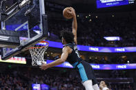 Portland Trail Blazers guard Shaedon Sharpe (17) dunks against the Utah Jazz in the first half during an NBA basketball game, Wednesday, March 22, 2023, in Salt Lake City. (AP Photo/Jeff Swinger)