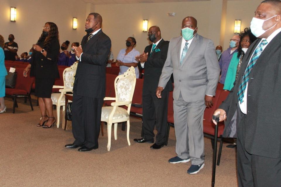 Parishioners participate in the pastor's anniversary celebration service Sunday at First Missionary Baptist Church.