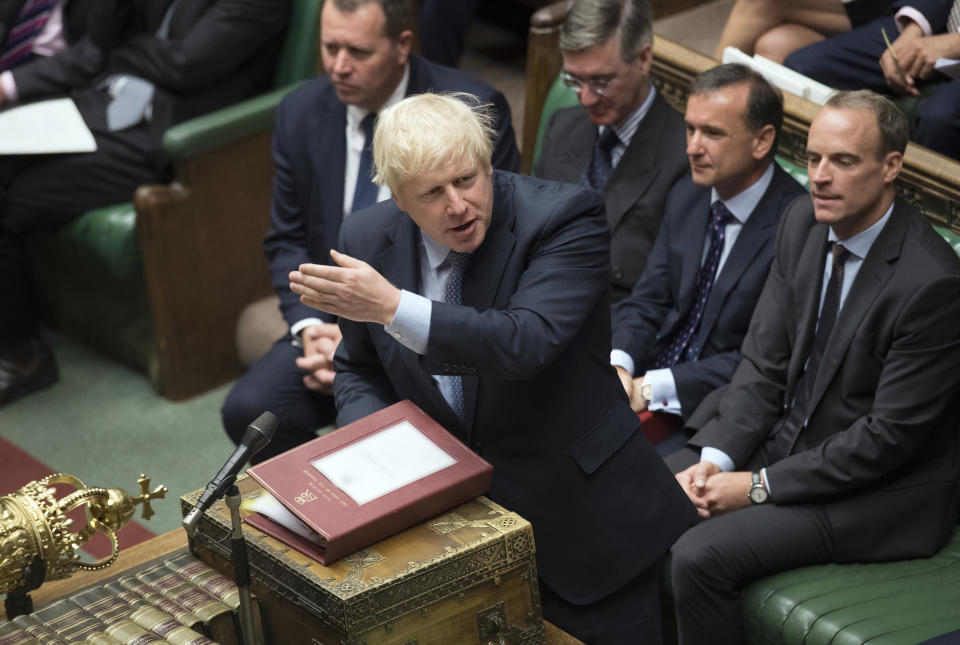 In this handout photo provided by the House of Commons, Britain's Prime Minister Boris Johnson gestures during his first Prime Minister's Questions, in the House of Commons in London, Wednesday, Sept. 4, 2019. Britain's Parliament is facing a second straight day of political turmoil as lawmakers fought Prime Minister Boris Johnson's plan to deliver Brexit in less than two months, come what may. Johnson is threatening to dissolve the House of Commons and hold a national election that he hopes might produce a less fractious crop of legislators. (Jessica Taylor/House of Commons via AP)