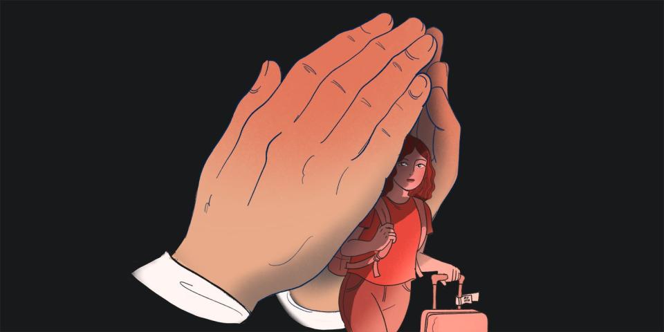 A woman with a suitcase is shielded by two large hands in prayer.