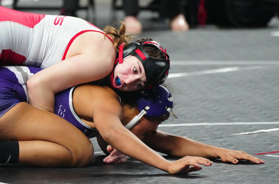 February 18, 2023; Phoenix, Ariz; USA; Liberty wrestler Taylor Colangelo wrestles Cesar Chavez wrestler Jamie Laswell in the 132 lbs State Championship match during the State High School Wrestling Championships at Veterans Memorial Coliseum. 