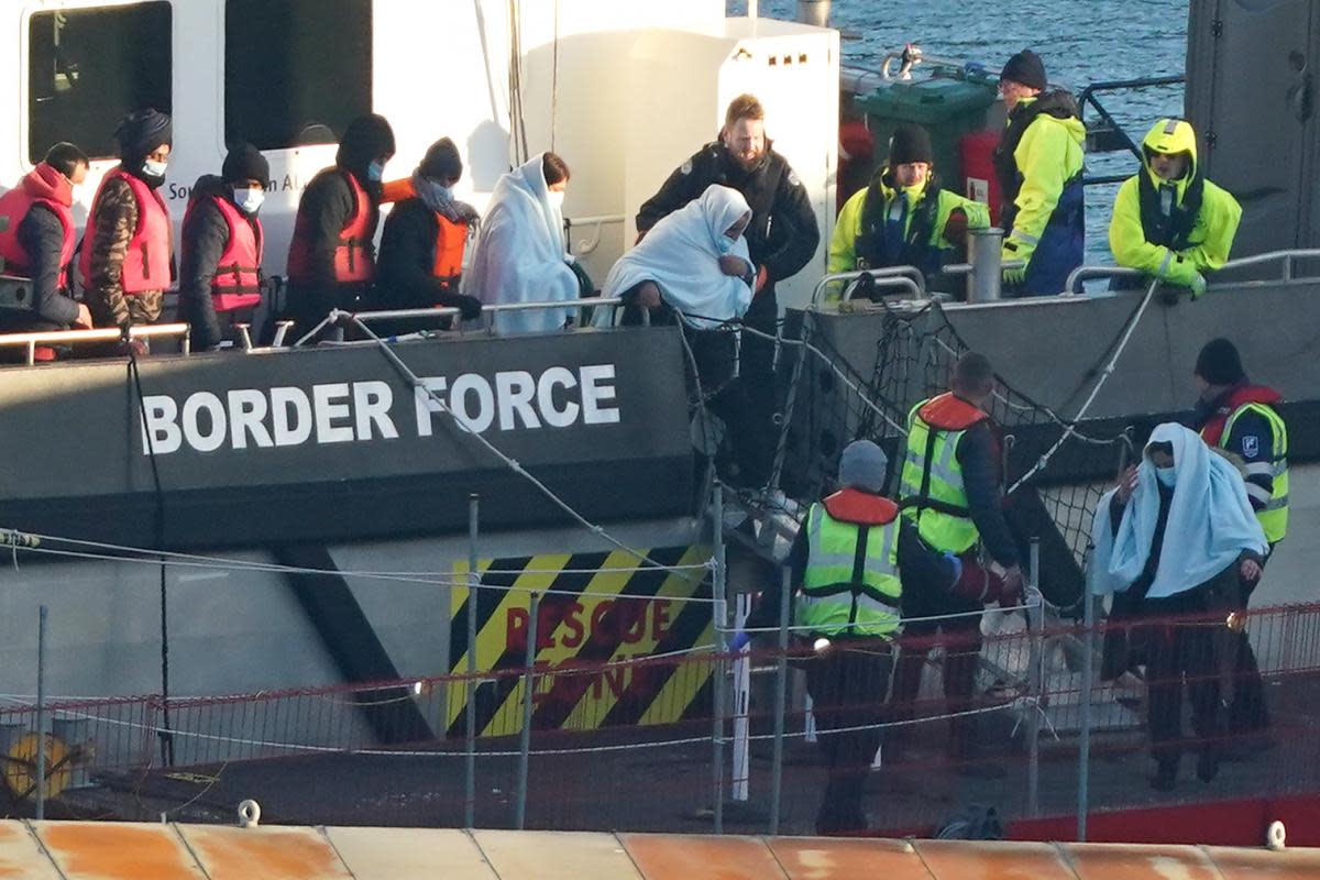 A group of people thought to be migrants are brought in to Dover, Kent, onboard a Border Force vessel, following a small boat incident in the Channel. <i>(Image: Gareth Fuller/PA Wire)</i>