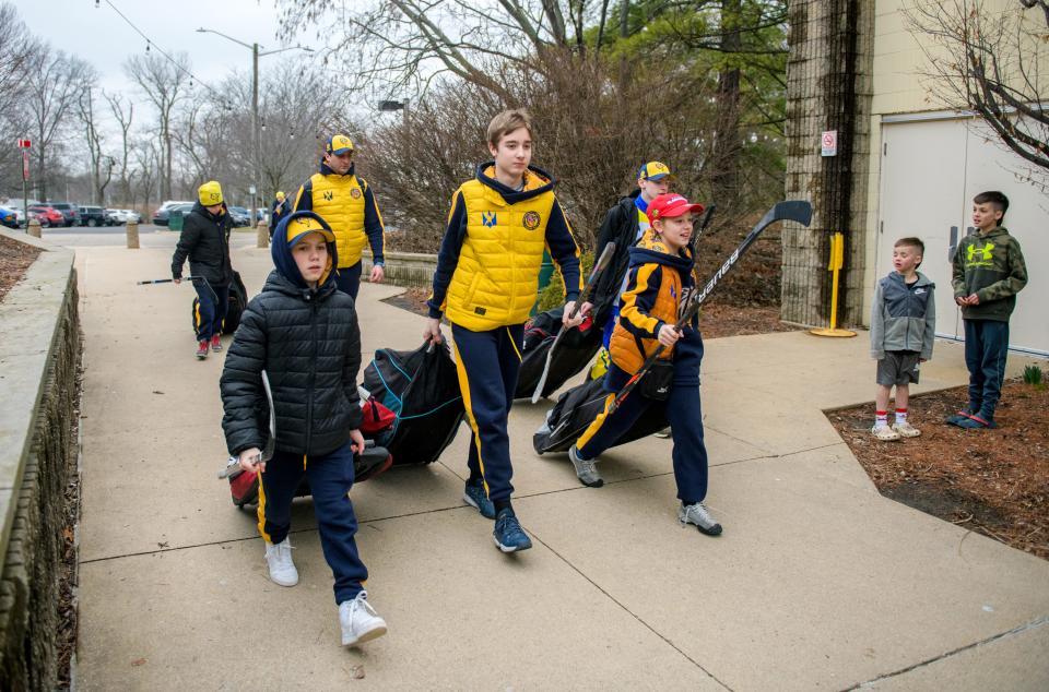 A group of Ukrainian youth hockey players walk into Owens Center for an exhibition game Thursday, March 23, 2023 against youth hockey players from Peoria, Pekin and Springfield as part of a Hockey for Heroes fundraiser organized by the nonprofit charity Help for Heroes of Ukraine. The Ukrainians came from the war-torn city of Kharkiv where their home hockey rink was destroyed in a missile attack.