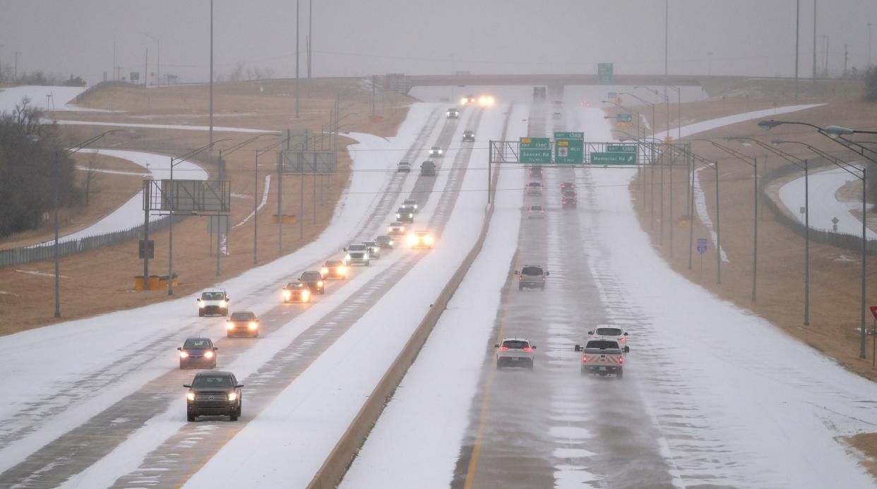 Cars travel along Interstate 35 in north Oklahoma City during a winter storm that hit the state on Wednesday.