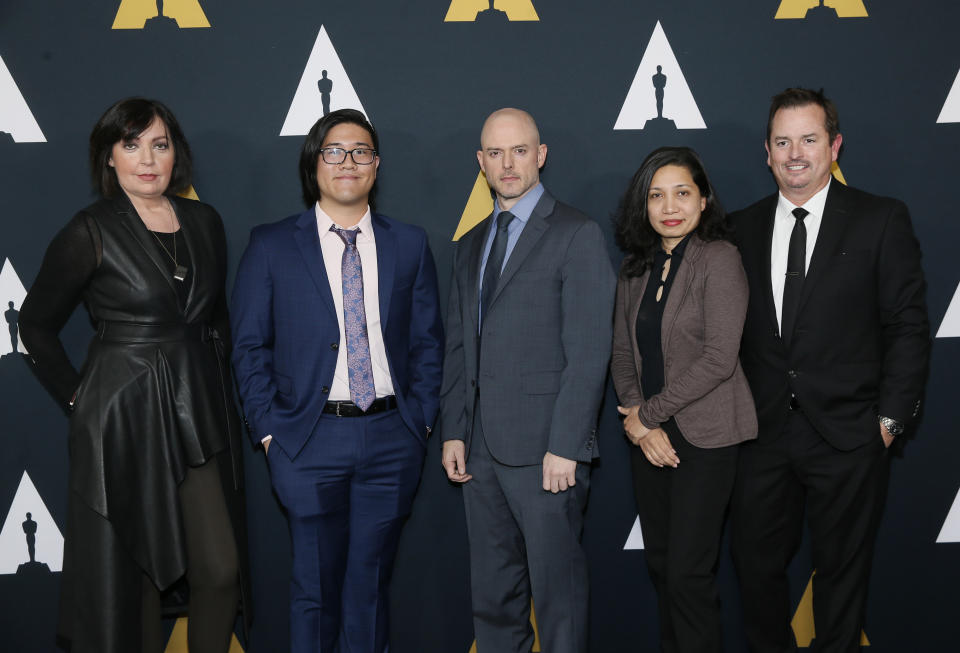 From left to right, Nicholl fellows Karen McDermott, Aaron Chung, Walker McKnight, Renee Pillai and Sean Malcolm pose at the Academy Nicholl Fellowships in Screenwriting Awards and Live Read at the Academy of Motion Picture Arts and Sciences Samuel Goldwyn Theater on Thursday, Nov. 7, 2019, in Beverly Hills, Calif. (Photo by Danny Moloshok/Invision/AP)