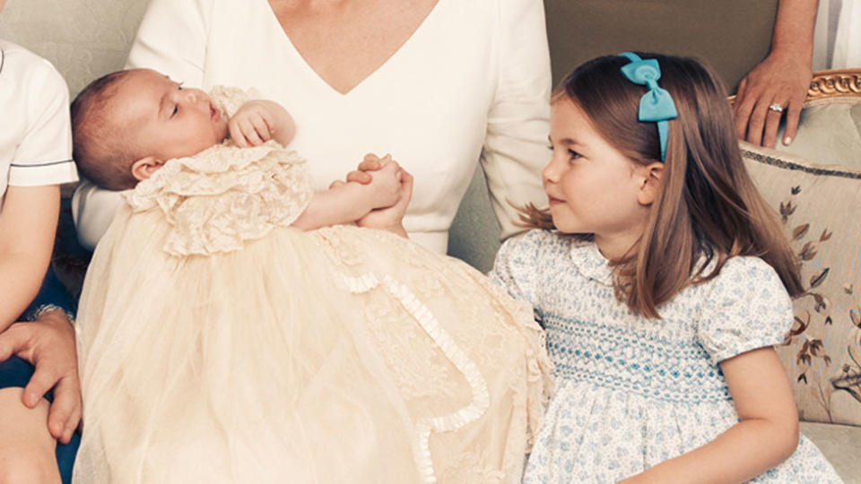 Princess Charlotte is doting on her younger brother, holding his hand. Source: Getty