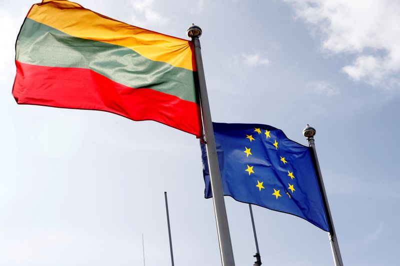 FILE PHOTO: European Union and Lithuanian flags flutter at border crossing point in Medininkai