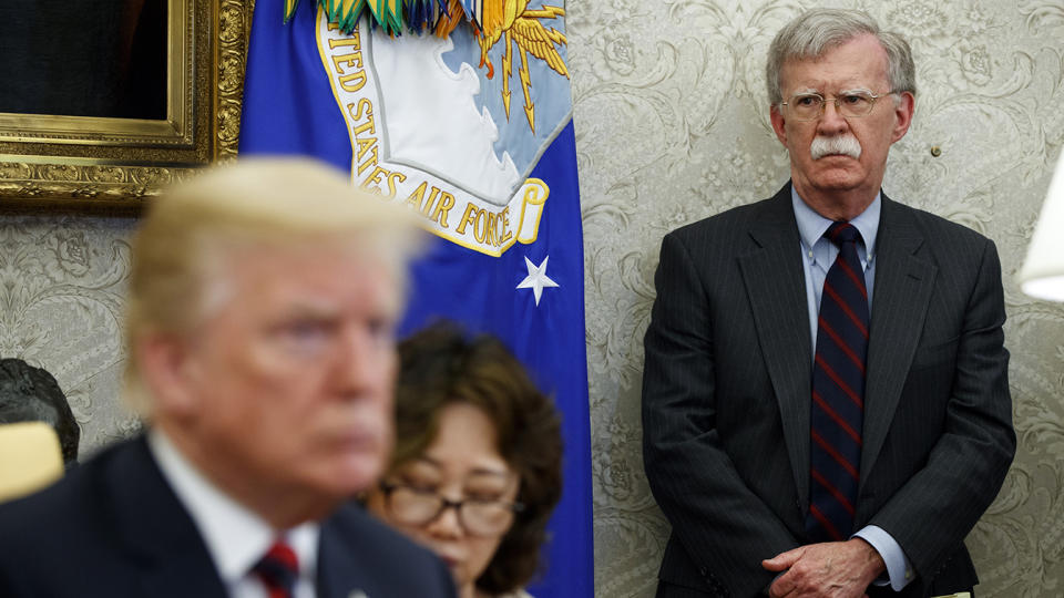 President Donald Trump meets with South Korean President Moon Jae-In in the Oval Office of the White House in 2018, in Washington, as national security adviser John Bolton watches. (Photo: Evan Vucci/AP)