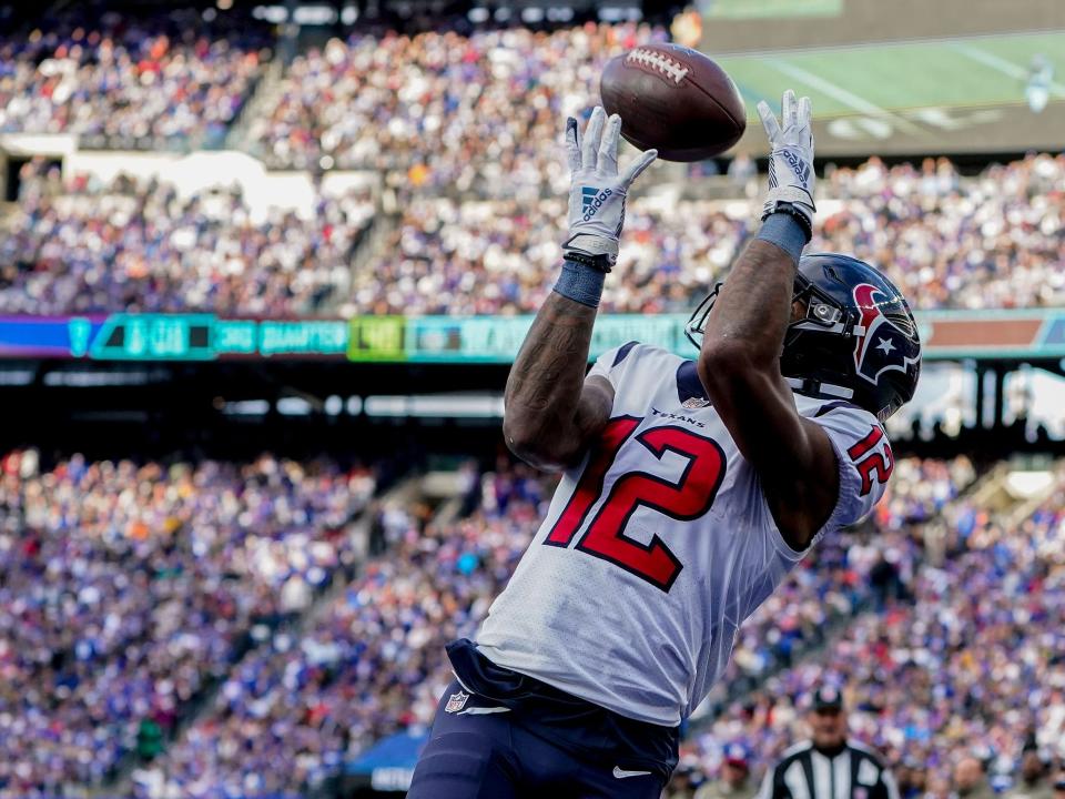 Nico Collins catches a touchdown against the New York Giants.