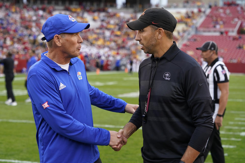 Kansas head coach Lance Leipold greets Iowa State head coach Matt Campbell, right, before an NCAA college football game, Saturday, Oct. 2, 2021, in Ames, Iowa. (AP Photo/Charlie Neibergall)